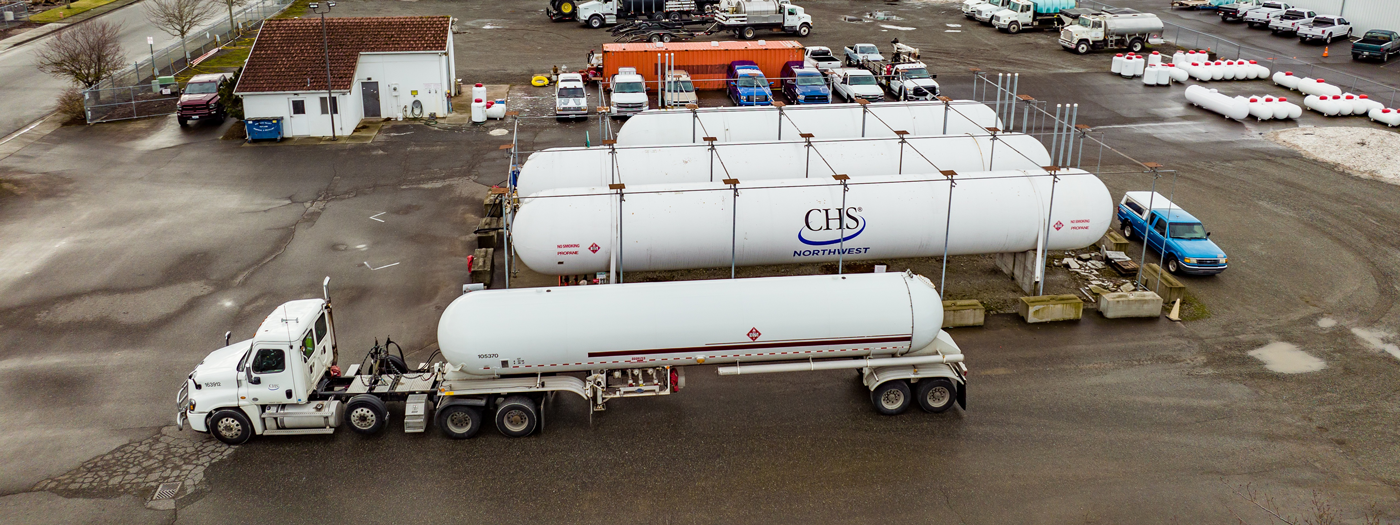Propane truck parked beside CHS Northwest propane tanks