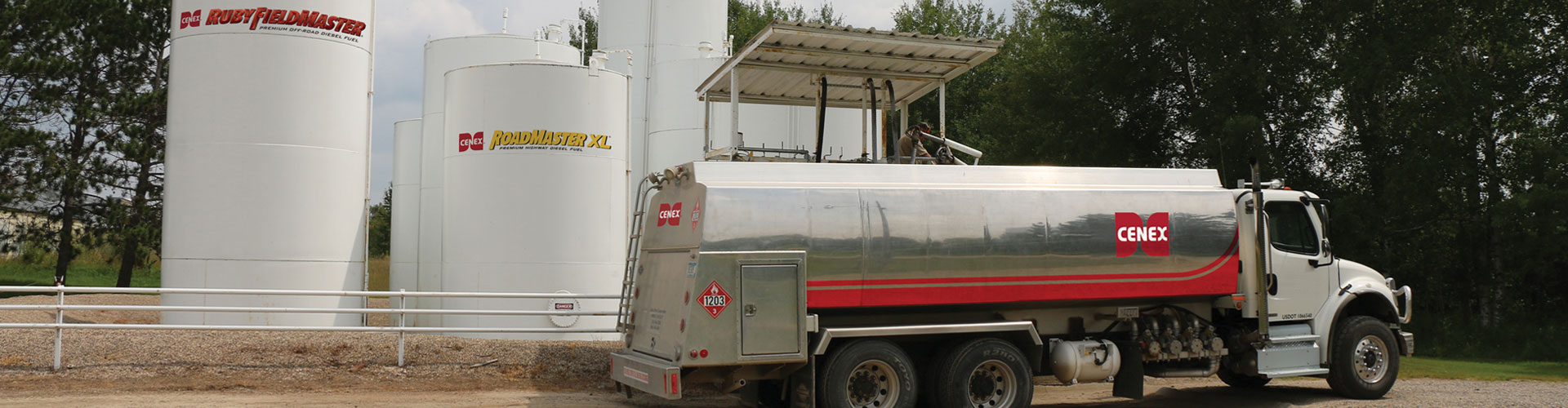 Propane truck parked beside Ruby Fieldmaster and Roadmaster XL fuel tanks